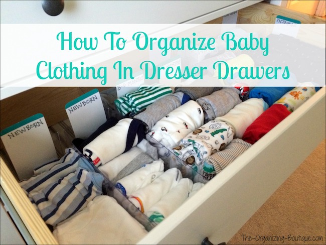 organizing baby clothes in drawers