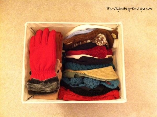 organize hat and gloves in home storage bins