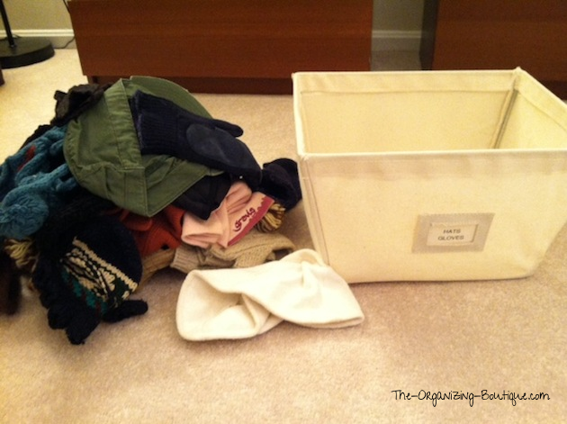 organize hats and gloves in home storage bins