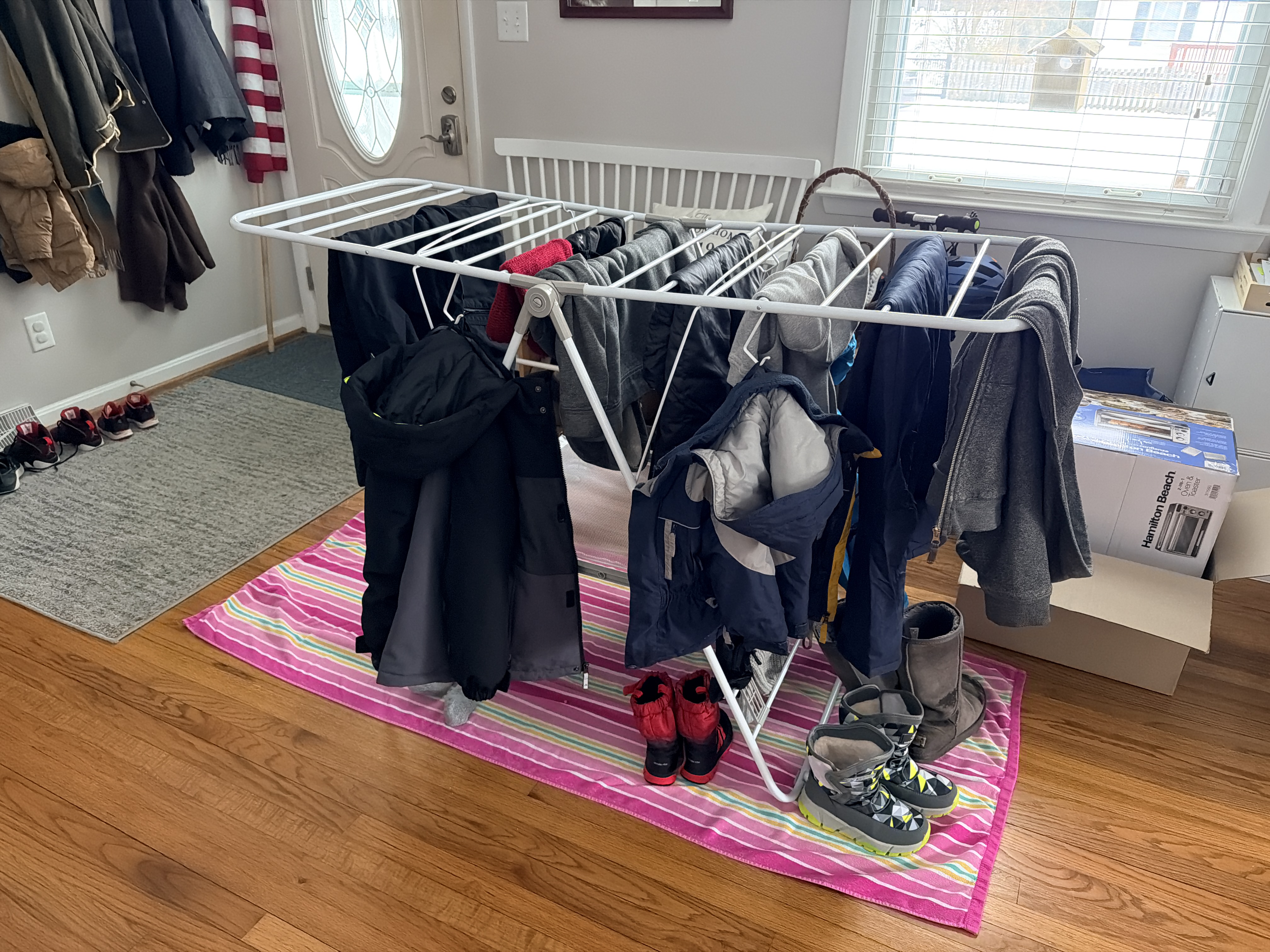 snow gear on laundry rack