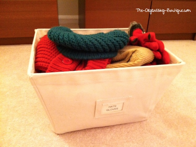 organize hats and gloves in home storage bins